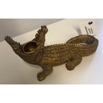 Recalled Golden-colored crocodile candleholder