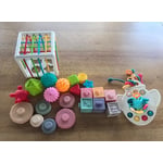 Recalled 5-in-1 Montessori Toy Set (airplane shaped teething toy on far right)