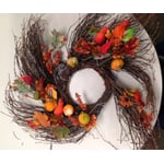 Autumn wreath with silk leaves, pumpkins and gourds