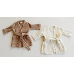 Recalled Goumi children's robes in natural and alabaster color