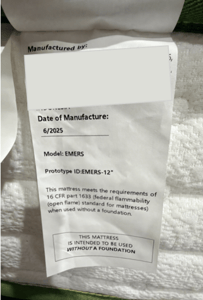 “Prototype ID: ” and the manufacture date “6/2025” are printed on a sewn-in white label located on one side of the mattress.