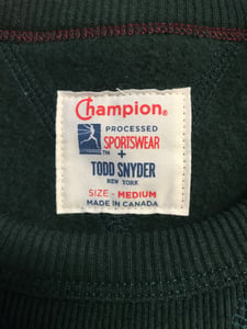 Label at the neck of the sweatshirt