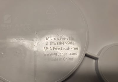 Back of WIC Nutrition Plate - safety label, Brush Art website, and location of manufacture