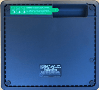 Green label located beneath the base of recalled Spansive Source phone chargers