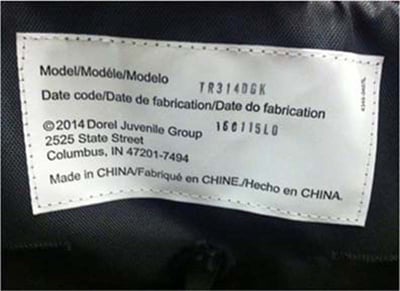 White label with model number on the back of the stroller seat