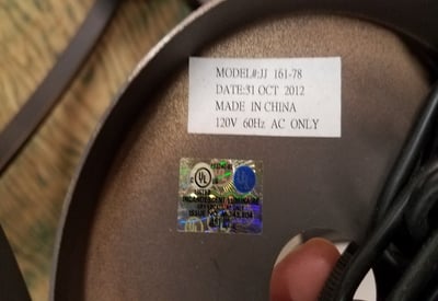 Label with model number and date code on chandelier’s canopy