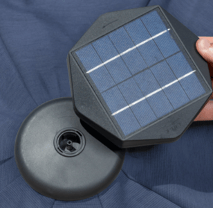 The solar panel puck located at the top of the umbrella