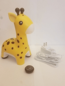 The recalled HoMedics Giraffe Comfort Creatures Nightlight with detached foot.