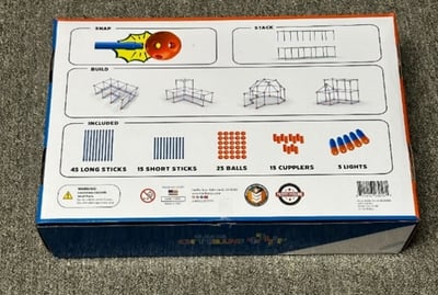 The recalled Intellio Toys' Bright Builder fort kit has 100 pieces and a pack of five flashlights with button cell batteries. A photo of the flashlights appears on the back of the recalled Bright Builder fort kits.
