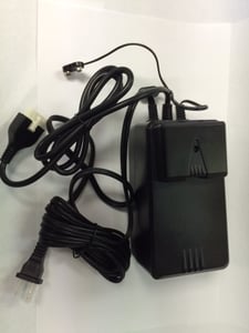 Power supply with cover attached