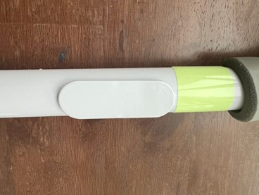 Light mount located below the grip handle on the recalled bed rails