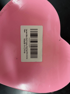Newmemo and "Amazon FNSKU X0034COQMP" appear on a label on the underside of the ring's packaging
