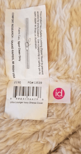 Three sewn-in tags read:  “id COLORS,” “RN48711,” code “PO#12991” or “PO#13539,” the care and use instructions and a warning notice.