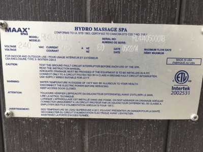 Serial number plate on front corner of hot tub