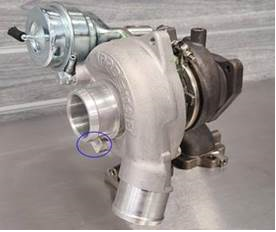 Part Number "3023738" appears on a rectangular area on the passenger side of the turbocharger.