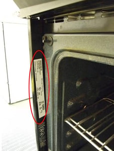 Slide-in serial plate—left side of oven with door open