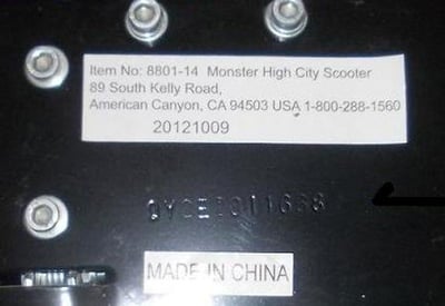 The model number and the manufacture date are printed on a label on the underside of the scooter