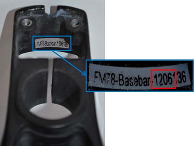 The serial number and date code are inside the base bar on the rear wall.