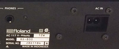 Model number and serial number location on the rear of the piano
