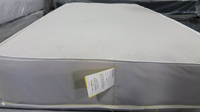 Mattress with federal tag sewn at the foot