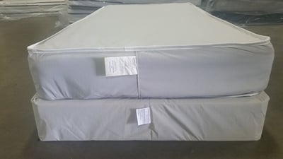 Mattress and foundation with federal tag sewn at the foot of each