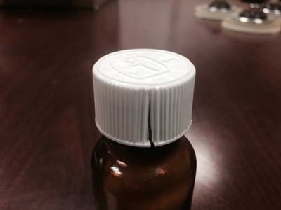 Close up view of the Temozolomide Capsules cracked cap rendering the child-resistant closure ineffective