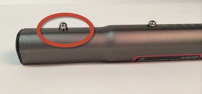 Lower lock button on the back of shovel