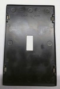 Back of decorative wall plate with “LHMC” stamped