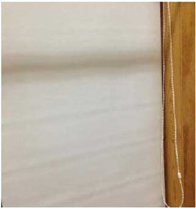 Recalled Carra Imports roller shade with a continuous loop bead chain