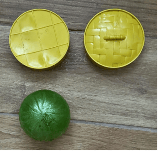 Recalled Rainbow Mystery Squishy Bun and tan container