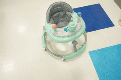 Recalled Zeno infant walker with gray frame, gray seat with "Babywalker" stitching, teal tray and toy attachments
