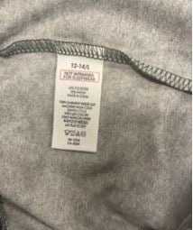 Sewn-in, side-seam label states size, "Not Intended for Sleepwear," "RN 15741," the fiber content, "Made in China," and washing instructions