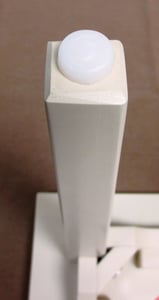 Plastic cap on the bottom of the stool’s leg