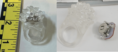Recalled light-up transparent jelly rings (Item No. PS271) – Ring and close up showing accessible button cell batteries.