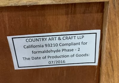 A Label on the back of the recalled Home Decorators Collection Print Block 4-Drawer Whitewash Chest lists the manufacturer and date of production.