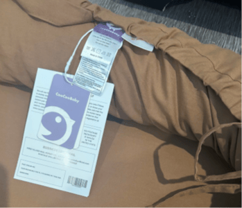 Tags showing "CooCooBaby" and the manufacturing information