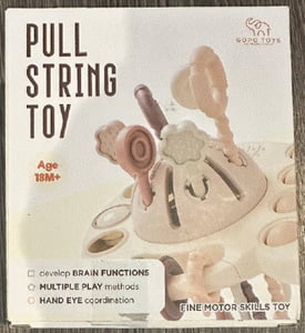 "GOPO TOYS" and "Pull String Toy" are printed on the front of the recalled teething toy packaging