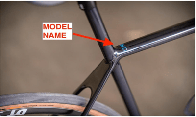 The model name on the top of the top tube, near the seat tube