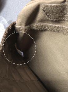PO number and style number can be found inside the front pocket along the side seam (white dotted line)
