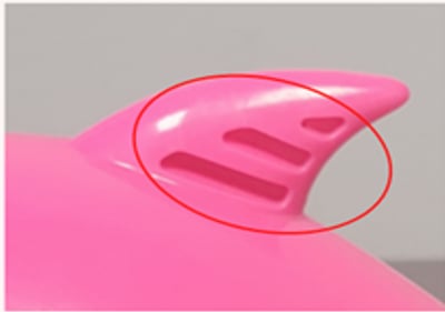 The recalled full-size toys have three grooves on one side of the hard plastic top fin