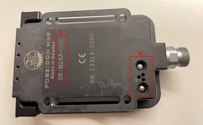 Serial Number beginning with "M28A-" and two wet-switches located on the back of recalled Poseidon A28 Dive Computer