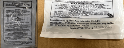 Packaging containing the recalled New Age tip restraint kits, stating "Manufactured by New Age Industries" at the bottom