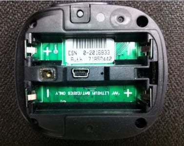 Recalled satellite communicator battery compartment showing the ESN label