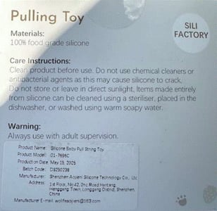 Manufacturer information printed on the back of the recalled teething toy packaging