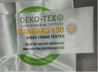 STANDARD 100 is printed on another tag inside the mattress cover