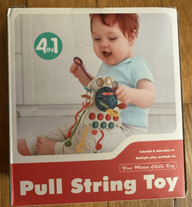 Recalled Tiyol Pull String Teething Toy (front of product packaging)