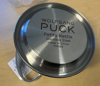 Wolfgang Puck Petite Kettle appears on the kettle's underside