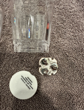 The recalled shot glasses have three batteries in a compartment in the underside of the glasses