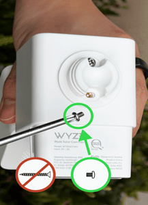 The short pan-head screws should be used to attach the solar panel to the camera. The long flat-head screws are for mounting the unit to the side of a hous