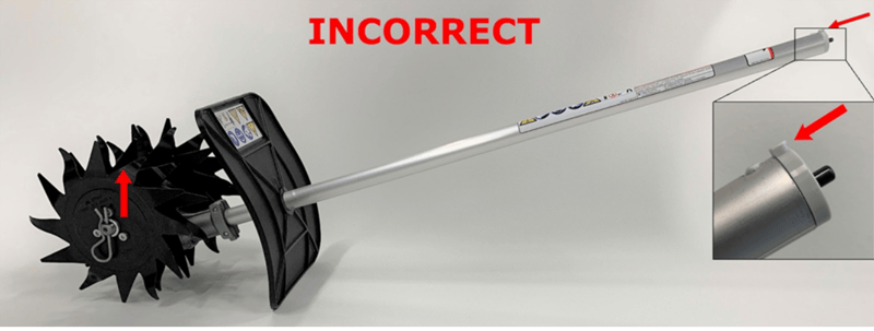 Recalled mini-cultivator (the gearbox is mounted incorrectly and upside down).  The axle is above the drive tube when the locating lug for coupling to the powerhead is facing up.